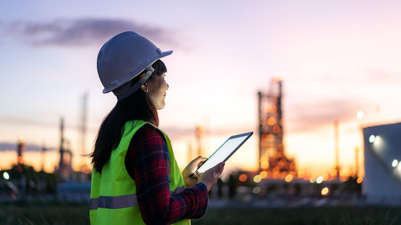 Woman performing audit at an industrial facility