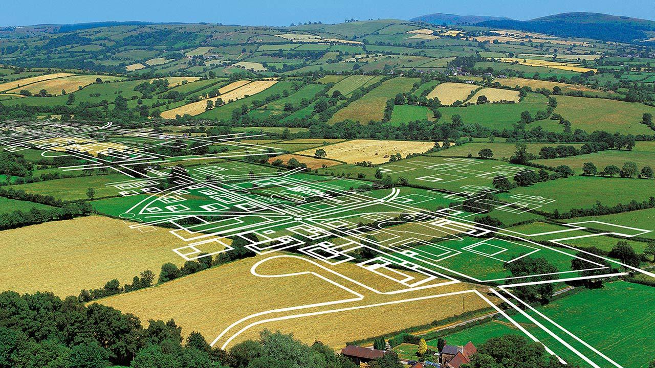 White outline of development plans on rural valley